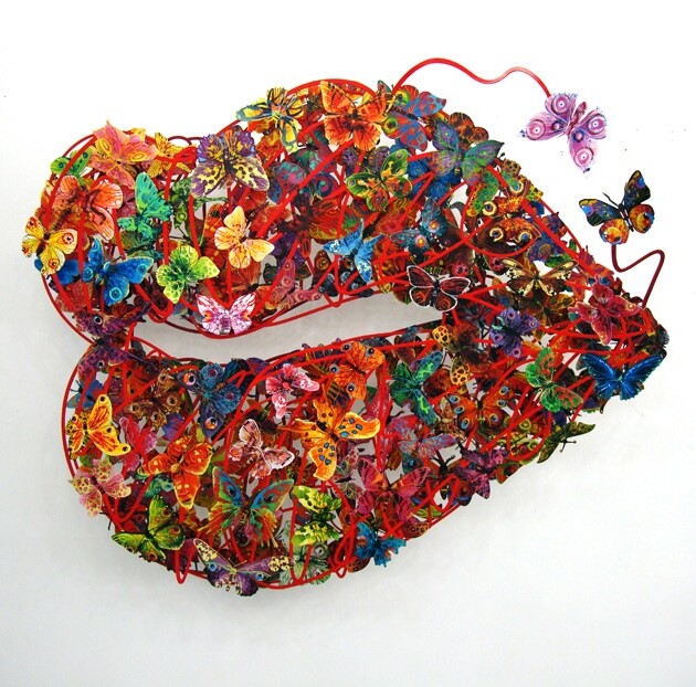Burning Lips by David Gerstein mixed media sculpture on metal featuring colorful butterflies forming a vibrant pair of lips